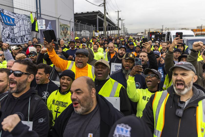 Workers take part in a port strike at Port Newark, Tuesday, Oct. 1, 2024, in Bayonne, N.J. (AP Photo/Eduardo Munoz Alvarez)