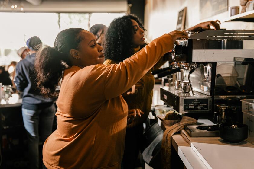 INGLEWOOD , CA - FEBRUARY 14: From Left - Shanita Nicholas and Amanda-Jane Thomas owners of Sip & Sonder coffee shop on Tuesday, Feb. 14, 2023 in Inglewood , CA. (Jason Armond / Los Angeles Times)