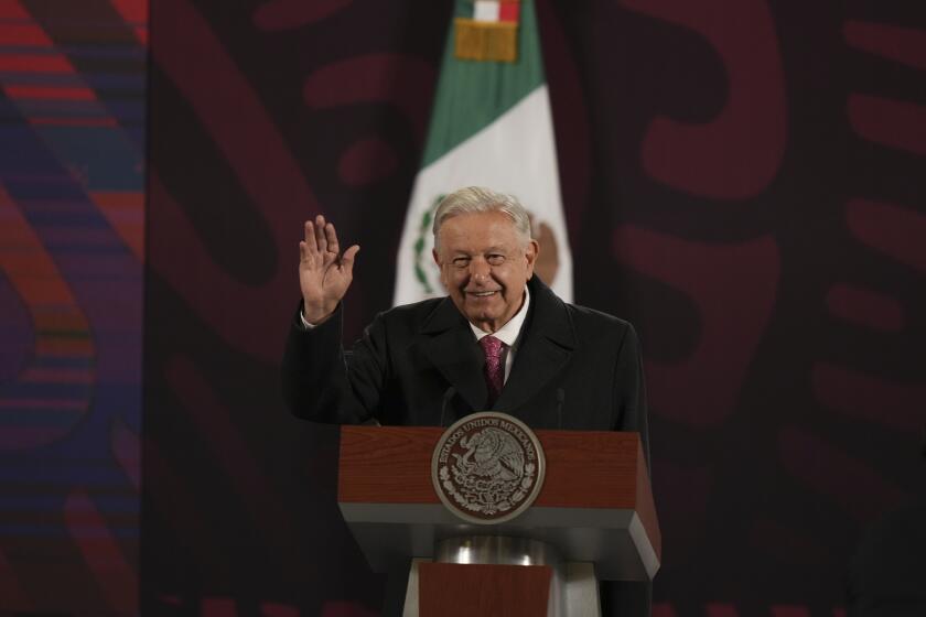 Mexican President Andres Manuel Lopez Obrador waves at the start of his last morning press conference, "La Mañanera," at the National Palace in Mexico City, Monday, Sept. 30, 2024. (AP Photo/Fernando Llano)