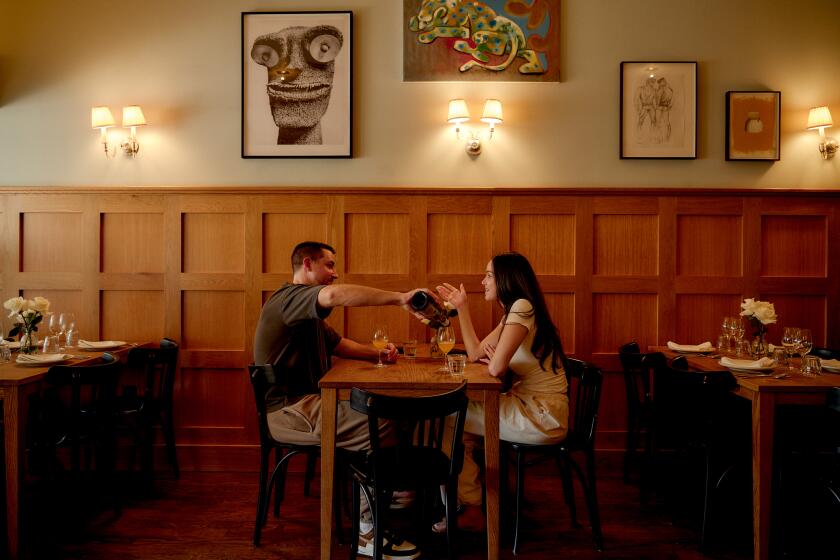 LOS ANGELES, CA - SEPTEMBER 13: Diners early in the evening at Stir Crazy on September 13, 2024 in Los Angeles, CA. (Shelby Moore / For The Times)