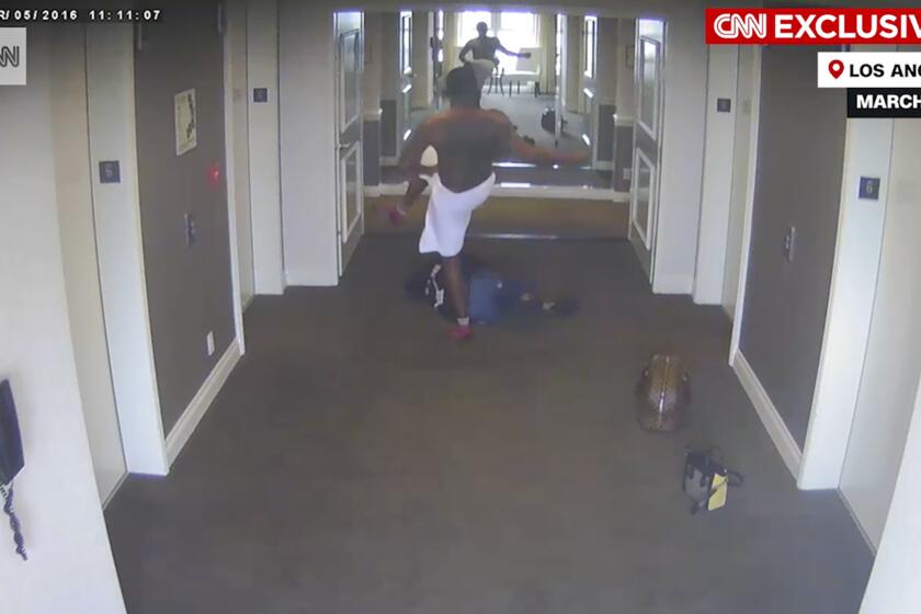 This frame grab taken from hotel security camera video and aired by CNN appears to show Sean “Diddy” Combs attacking singer Cassie in a Los Angeles hotel hallway in March 2016. (Hotel Security Camera Video/CNN via AP)