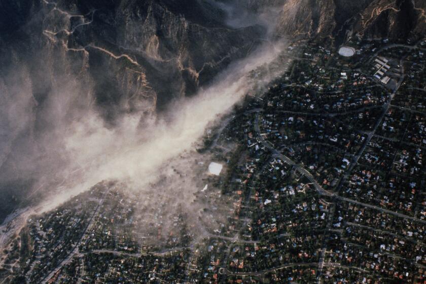 LA CANADA, CA - OCTOBER 1: An aerial view of the La Canada foothills abutting the epicenter as dust and dirt was violently thrown into the air on October 1, 1987 during the Richter Magnitude 5.9 earthquake which jolted Whittier, Alhambra and Pasadena in Los Angeles County, California. This image, of the "Whittier Narrows" earthquake, is one of the few still photographs ever taken of any earthquake while it is actually happening. (Photo by George Rose/Getty Images)