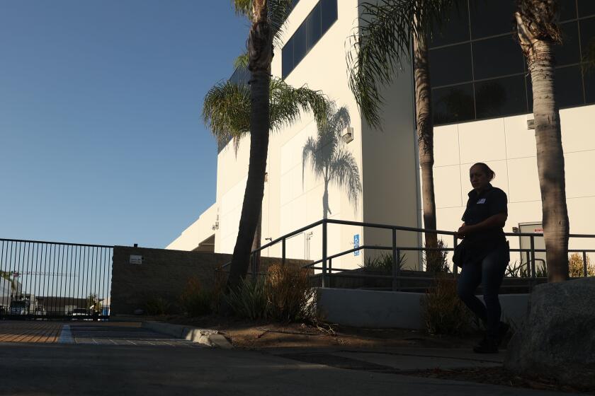 Inglewood, CA - August 15: A worker walks by Flying Food Group on Thursday, Aug. 15, 2024 in Inglewood, CA. (Michael Blackshire / Los Angeles Times)