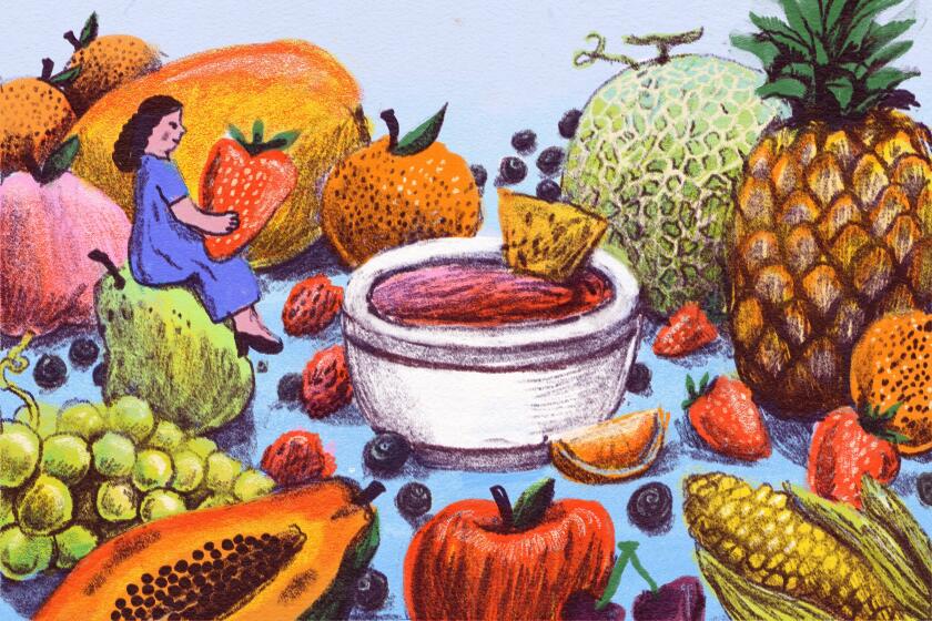 Illustrated author amongst large sized fruits