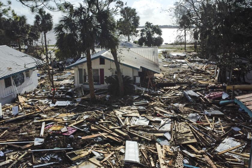 Destruction to the Faraway Inn Cottages and Motel is seen in the aftermath of Hurricane Helene, in Cedar Key, Fla., Friday, Sept. 27, 2024. (AP Photo/Stephen Smith)