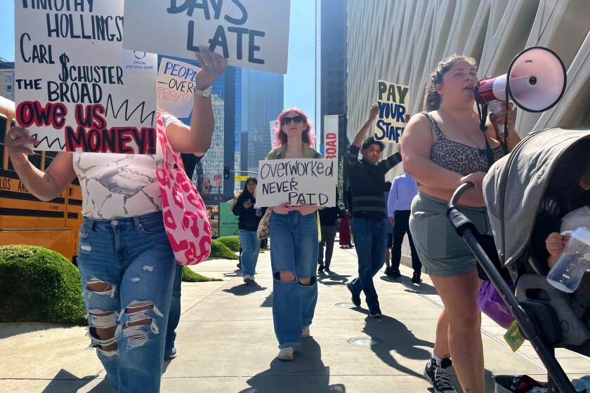 Former workers at the now shuttered Otium restaurant ,who say they’re owed unpaid wages, protested in front of the shuttered restaurant in downtown Los Angeles.