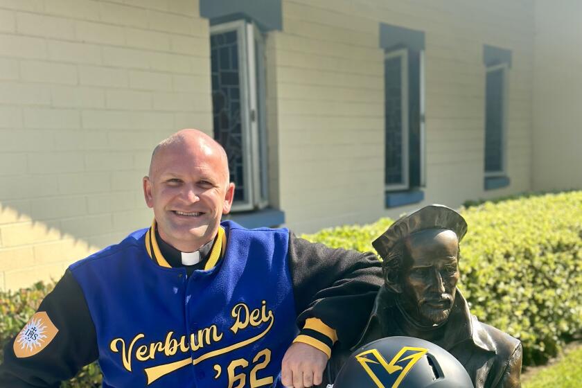 Verbum Dei president Father Travis Russell will try to rebuild the suspended football program.