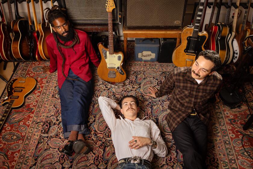 PASADENA-CA-AUGUST 30, 2024: Josh Lane, Alex Garcia, and Sal Samano, from left, of Thee Sacred Souls are photographed at Diamond West Studios in Pasadena on August 30, 2024. (Christina House / Los Angeles Times)